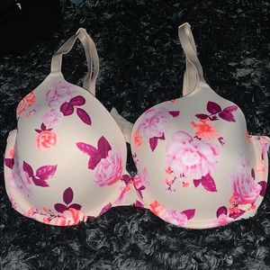 This is a cream colored bra with a flower print